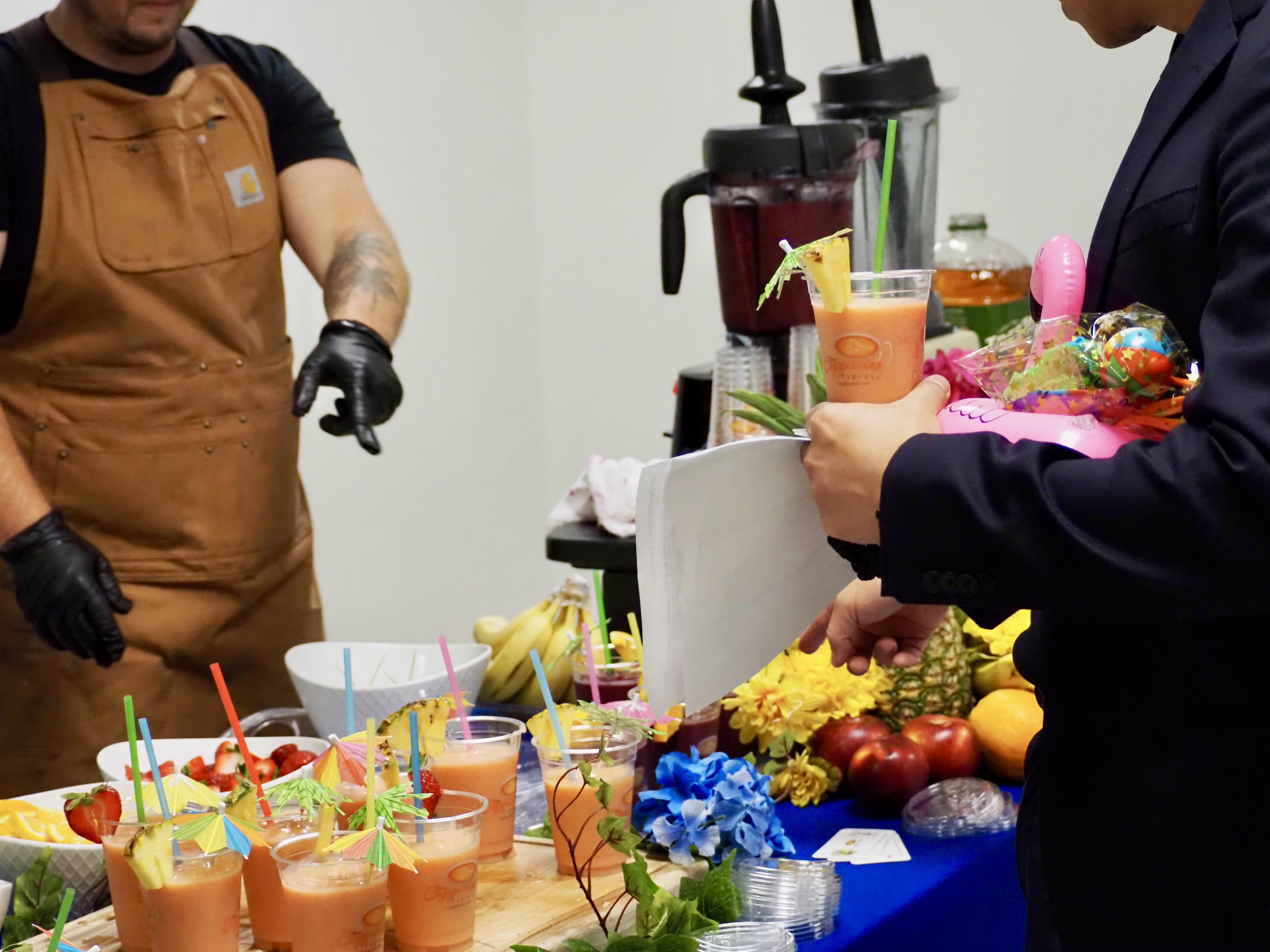 Customer Grabbing Smoothie — The Cappuccino Express Smoothies